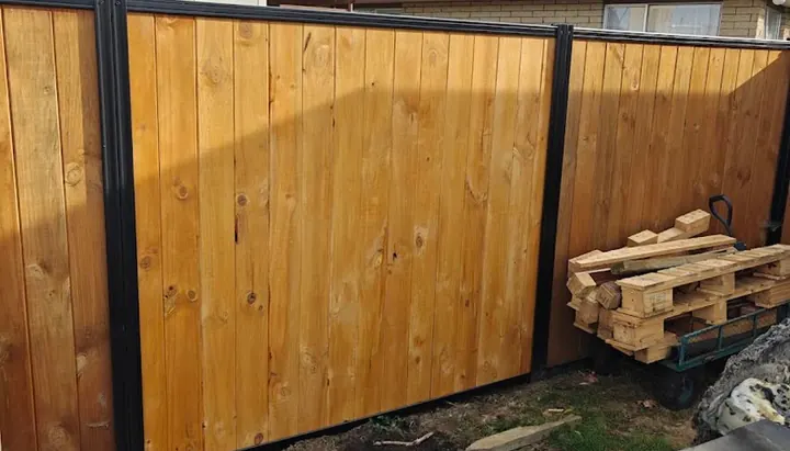 Newly built timber and steel-framed fence