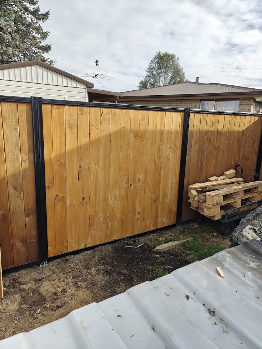 Newly built timber and steel-framed fence